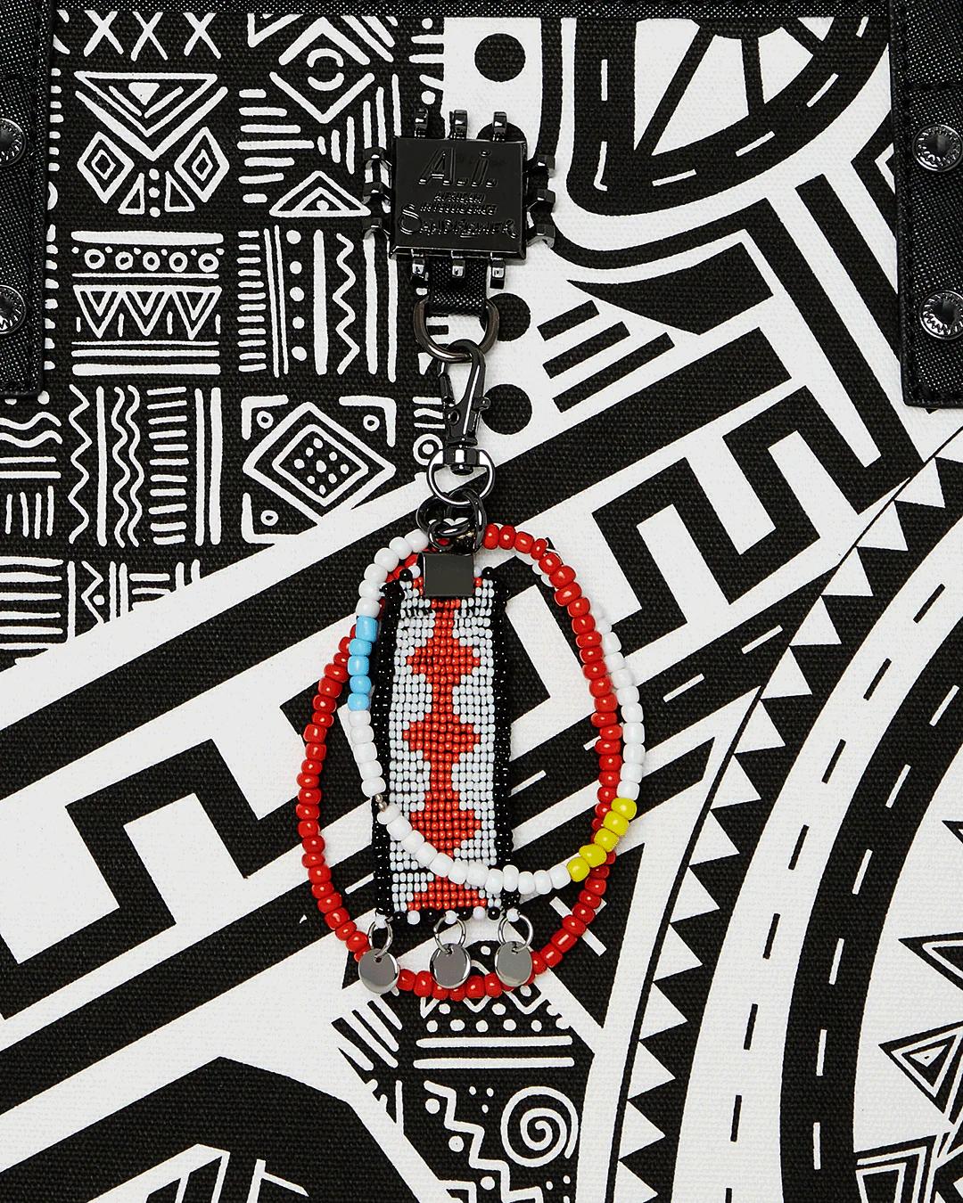 Sprayground A.I. AFRICAN INTELLIGENCE THE SKYHAWK WING TOTE - SANDFLOWER COLLAB