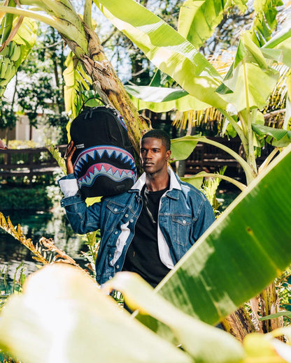 Sprayground A.I. AFRICAN INTELLIGENCE BORN AND RAISED BACKPACK - SANDFLOWER COLLAB