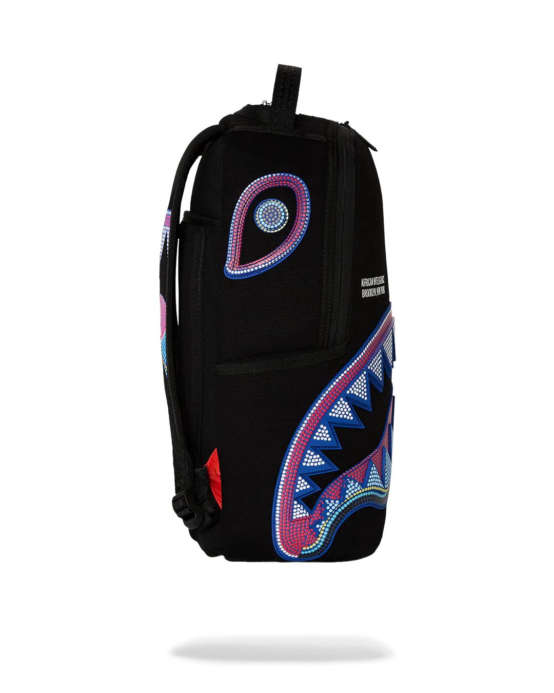 Sprayground A.I. AFRICAN INTELLIGENCE BORN AND RAISED BACKPACK - SANDFLOWER COLLAB