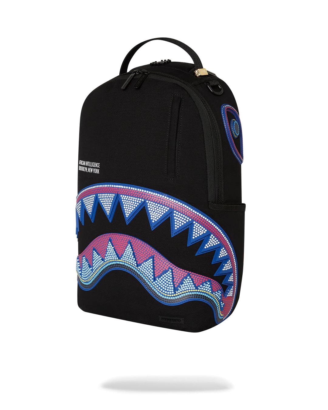 Sprayground A.I. AFRICAN INTELLIGENCE BORN AND RAISED BACKPACK - SANDFLOWER COLLAB