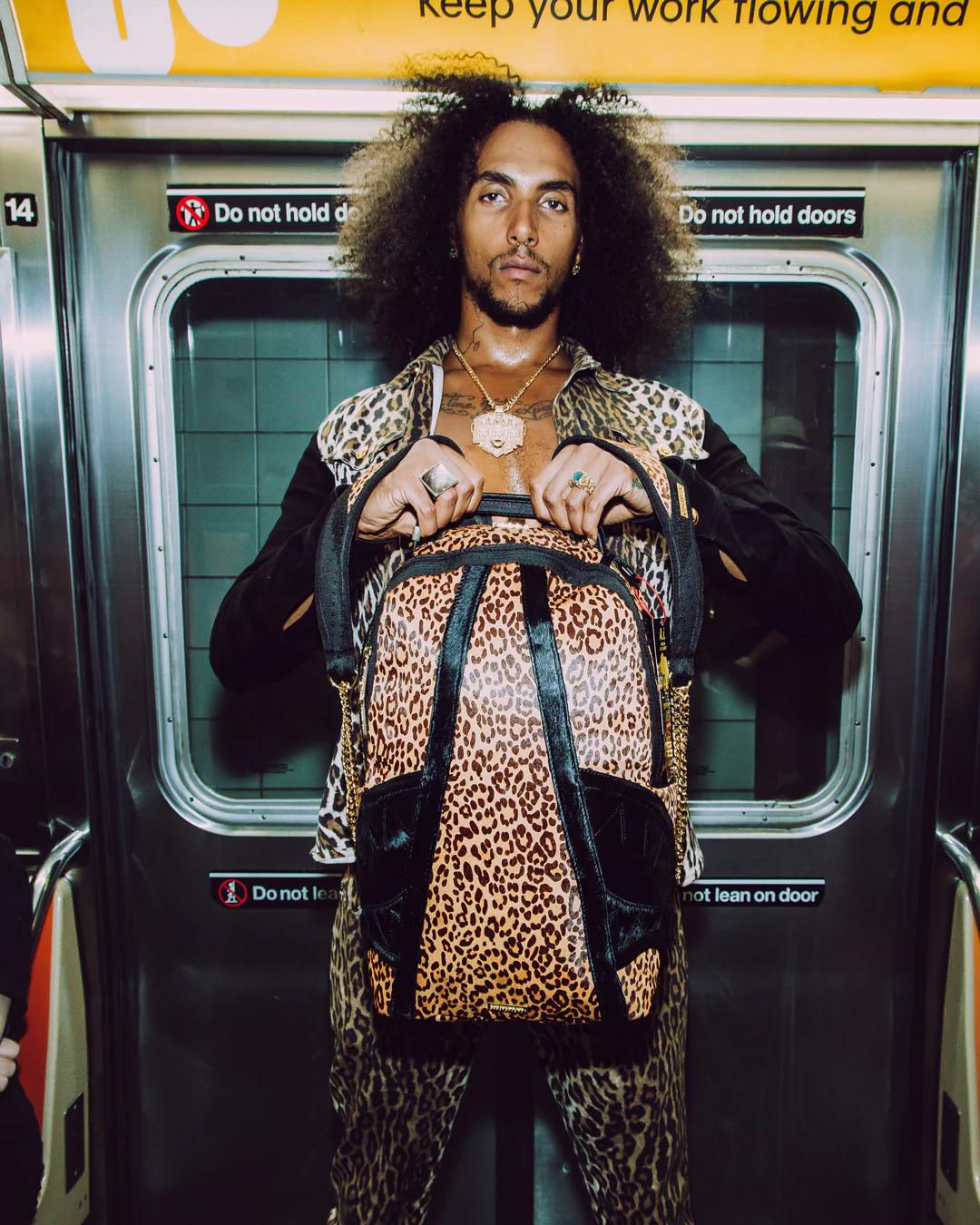 Sprayground AFRICAN INTELLIGENCE 9 COURAGE LIVES ON BACKPACK - SANDFLOWER COLLAB